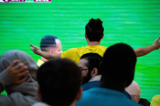 A Brazilian fan expresses his irritation towards a player’s missed attempt at a goal. As tensions rose in the game between Brazil and Cameroon, the crowd voiced their excitement and frustration.