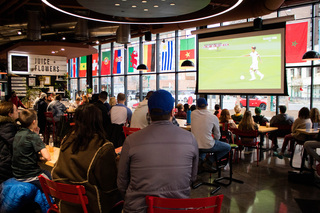 Syracuse residents enjoy the U.S.’s round of 16 against the Netherlands over a variety of food and beverages. Across the room, Salt City Coffee and Bar was overflowing with more fans quietly watching the game. 